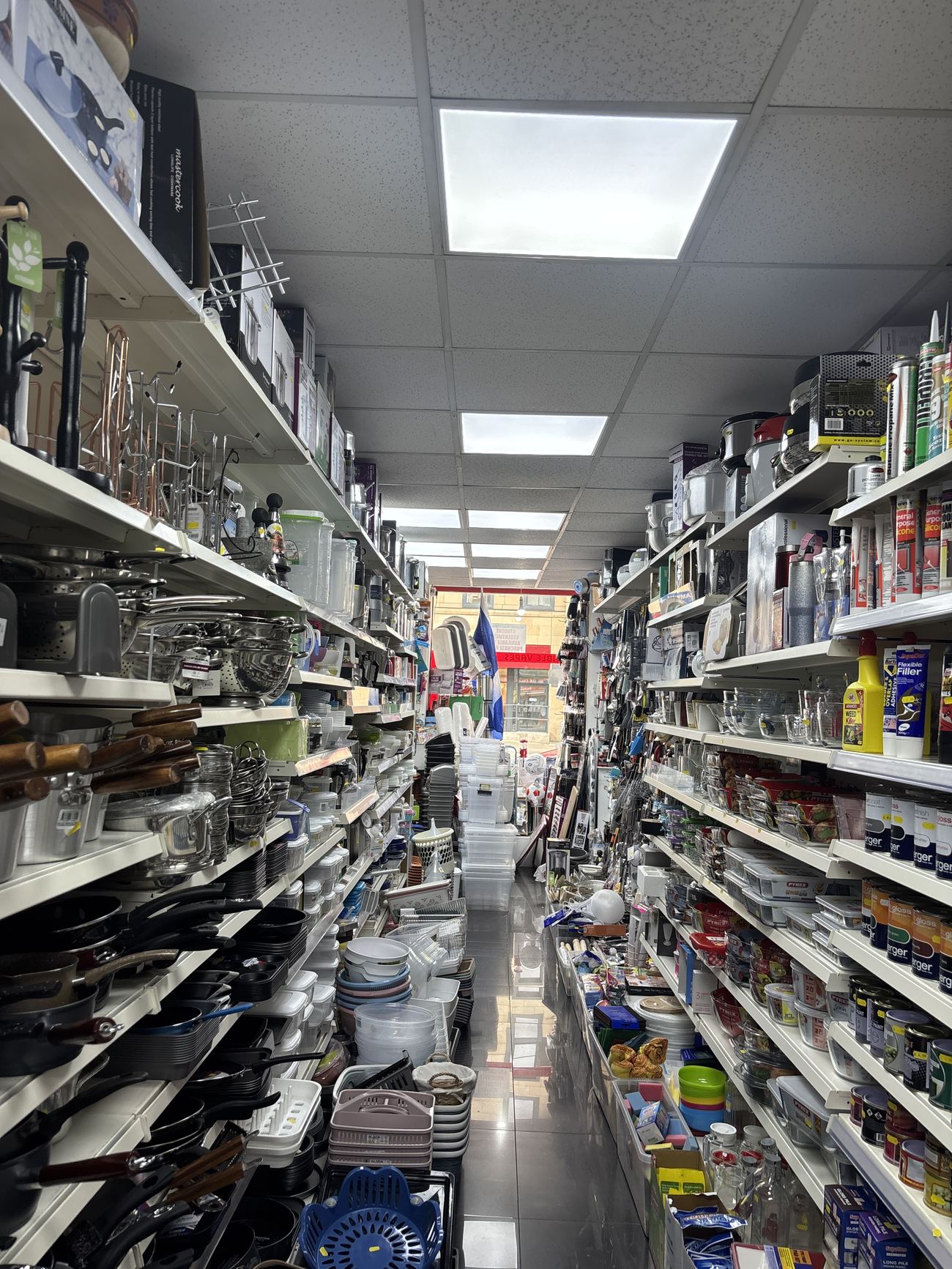 Inside Leith Bargain Store, aisles stocked with goods