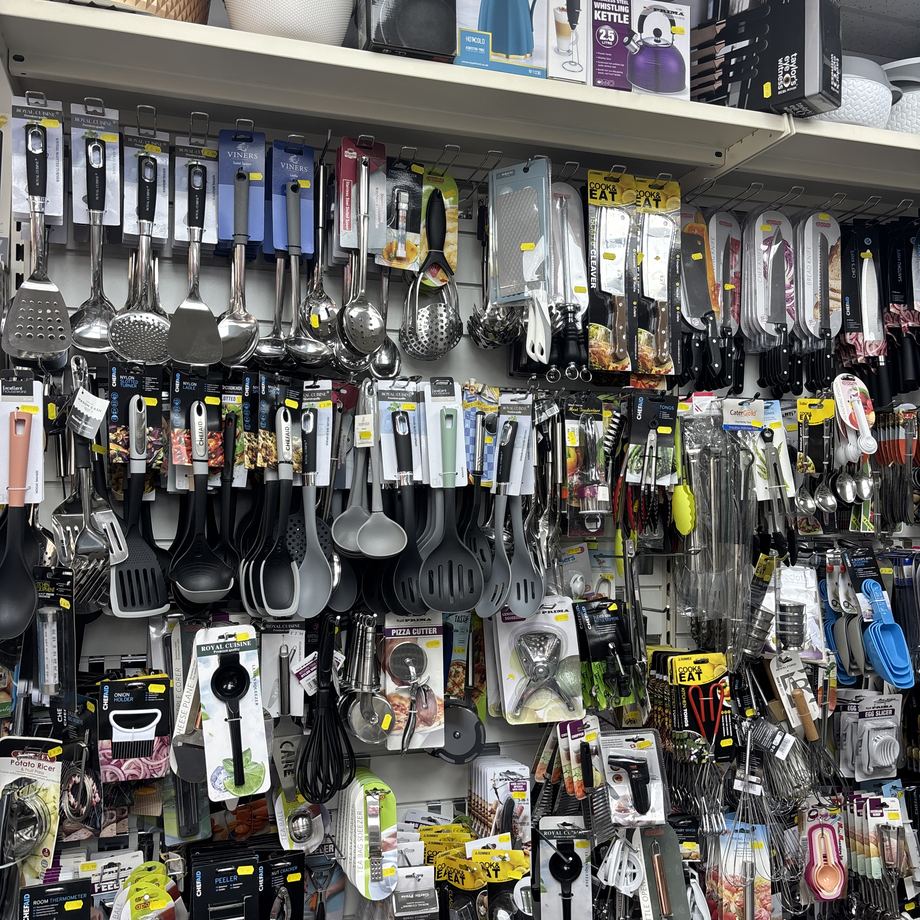 Wall of kitchen utensils, ladles and knives