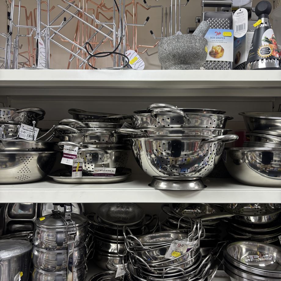 Stainless steel pots, pans and colanders